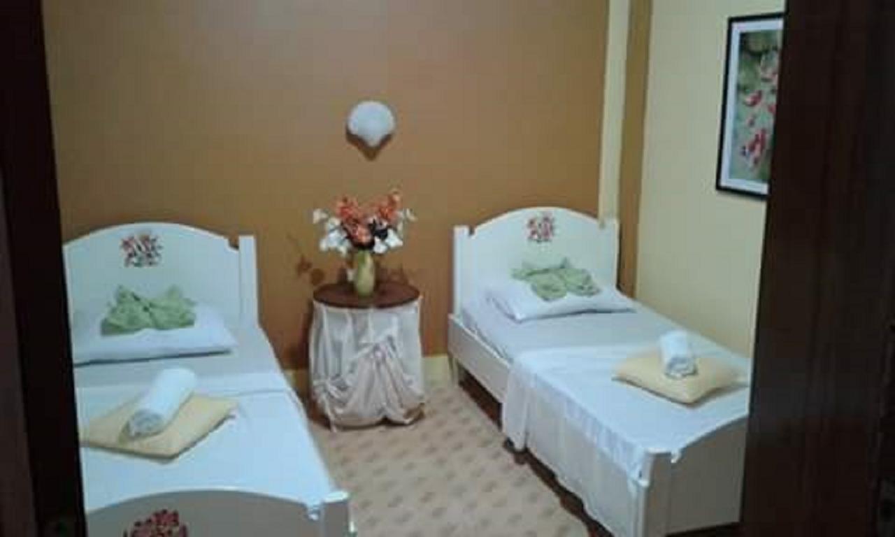 פנגלאו Traville Huts Palm Beach Inn מראה חיצוני תמונה